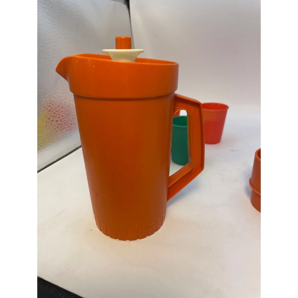 1970 vintage Tupperware  Toys  10 Piece;Orange pitcher with lid 4 cups 4 glasses